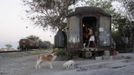 Judith walks inside a train carriage she calls home in Cadereyta on the outskirts of Monterrey August 8, 2012. Judith, her eight other family members and their pets have been living in the abandoned carriage next to a train track for the last 15 years. Judith's grandparents moved from Tamaulipas to Cadereyta after one of their sons was killed on the street by a stray bullet. The family moved into the carriage, which was empty after having been occupied by a vagabond, after living for the first five years in a rented room after arriving in Cadereyta. Picture taken August 8, 2012. REUTERS/Daniel Becerril (MEXICO - Tags: SOCIETY) Published: Srp. 11, 2012, 2:21 dop.