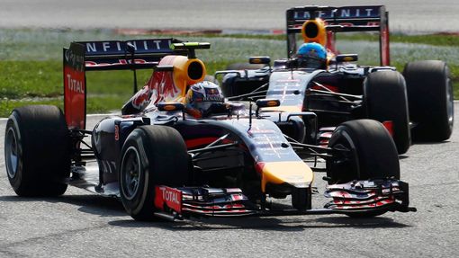 Red Bull Formula One driver Daniel Ricciardo of Australia drives ahead of team mate Sebastian Vettel of Germany during the Malaysian F1 Grand Prix at Sepang International