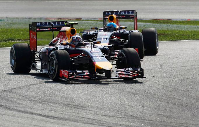 Red Bull Formula One driver Daniel Ricciardo of Australia drives ahead of team mate Sebastian Vettel of Germany during the Malaysian F1 Grand Prix at Sepang International