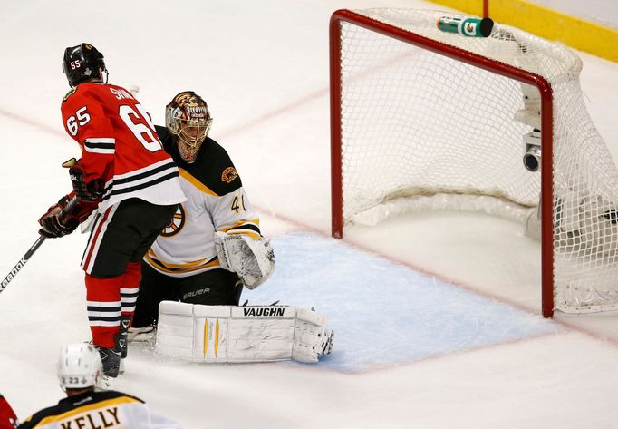 Chicago Blackhawks' Andrew Shaw (65) scores the game-winning goal past Boston Bruins goalie Tuukka Rask during triple overtime in Game 1 of their NHL Stanley Cup Finals h