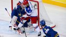 Sweden's goalie Anders Nilsson (L) saves in front of Russia's Nikolai Kulyomin in the first period of their men's ice hockey World Championship semi-final game at Minsk A