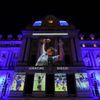 Photographs of late soccer legend Diego Maradona are projected on the Kirchner Cultural Centre, in Buenos Aires