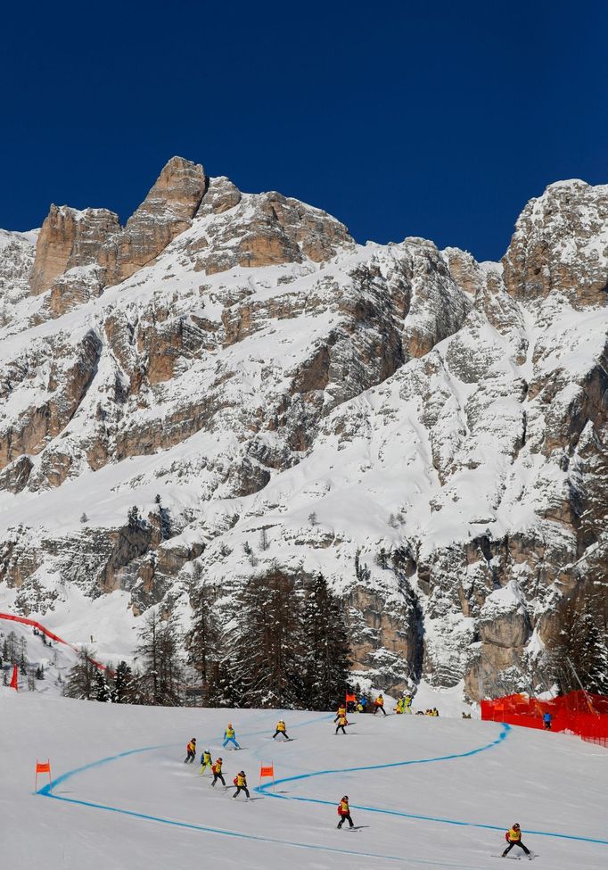 Alpine Skiing - FIS Alpine World Ski Championships - Women's Downhill Training - Cortina d'Ampezzo, Italy - February 12, 2021 Slope workers before the start REUTERS/Leonh