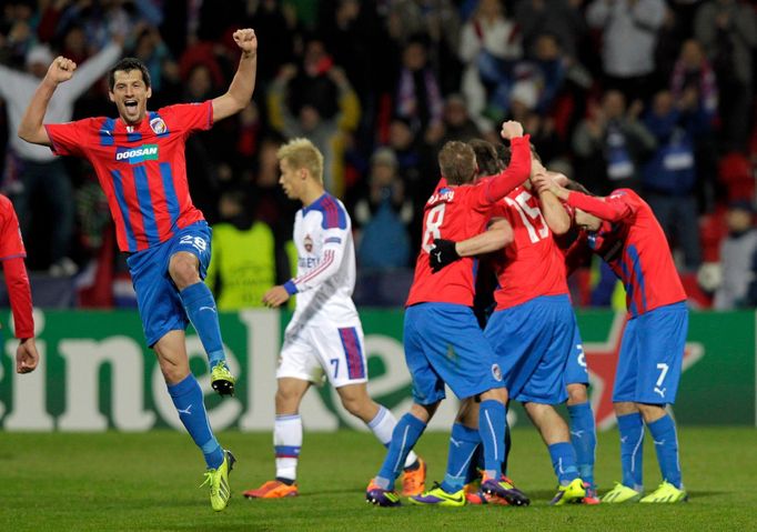 CSKA Moscow's Keisuke Honda walks past Viktoria Plzen's Marian Cisovsky and his teammates celebrating after their Champions League soccer match in Plzen