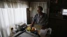 Jack Waddington, 80, sits in his trailer in which he has lived for 13 years, in Village Trailer Park in Santa Monica, California, July 12, 2012. Developer Marc Luzzatto wants to relocate residents from the trailer park to make way for nearly 500 residences, office space, stores, cafes and yoga studios, close to where a light rail line is being built to connect downtown Los Angeles to the ocean. Village Trailer Park was built in 1951, and 90 percent of its residents are elderly, disabled or both, according to the Legal Aid Society. Many have lived there for decades in old trailers which they bought. The property is valued at as much as $30 million, according the LA Times. Picture taken July 12, 2012. REUTERS/Lucy Nicholson (UNITED STATES - Tags: REAL ESTATE BUSINESS SOCIETY POLITICS) Published: Čec. 14, 2012, 7:33 dop.