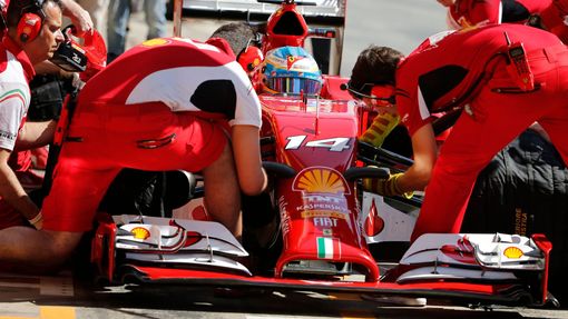 Ferrari Formula One driver Fernando Alonso of Spain performs a pit stop during the first practice session of the Spanish F1 Grand Prix at the Barcelona-Catalunya Circuit
