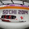 Canada's pilot Spring and his teammates speed down the track during a four-man bobsleigh training session in Rosa Khutor, during the Sochi 2014 Winter Olympics