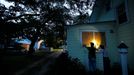 Russell Meadows, left, helps neighbor Rob Muller board up his home ahead of Hurricane Florence in Morehead City, N.C.