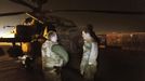 Britain's Prince Harry (R) inspects his Apache helicopter before a night mission at Camp Bastion, southern Afghanistan in this photograph taken December 11, 2012, and released January 21, 2013. The Prince, who is serving as a pilot/gunner with 662 Squadron Army Air Corps, is on a posting to Afghanistan that runs from September 2012 to January 2013. Photograph taken December 11, 2012. Photograph pixelated at source. REUTERS/John Stillwell/Pool (AFGHANISTAN - Tags: MILITARY POLITICS SOCIETY ROYALS CONFLICT) Published: Led. 21, 2013, 8:19 odp.