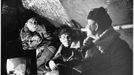 SOLDIERS IN DUG-OUT Soviet soldiers entertain themselves in a dug-out. Date: 1942-43 Source: Unattributed photograph in Meledin Collection