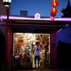 Man stands in a store selling lanterns in Chinatown in Los Angeles, California