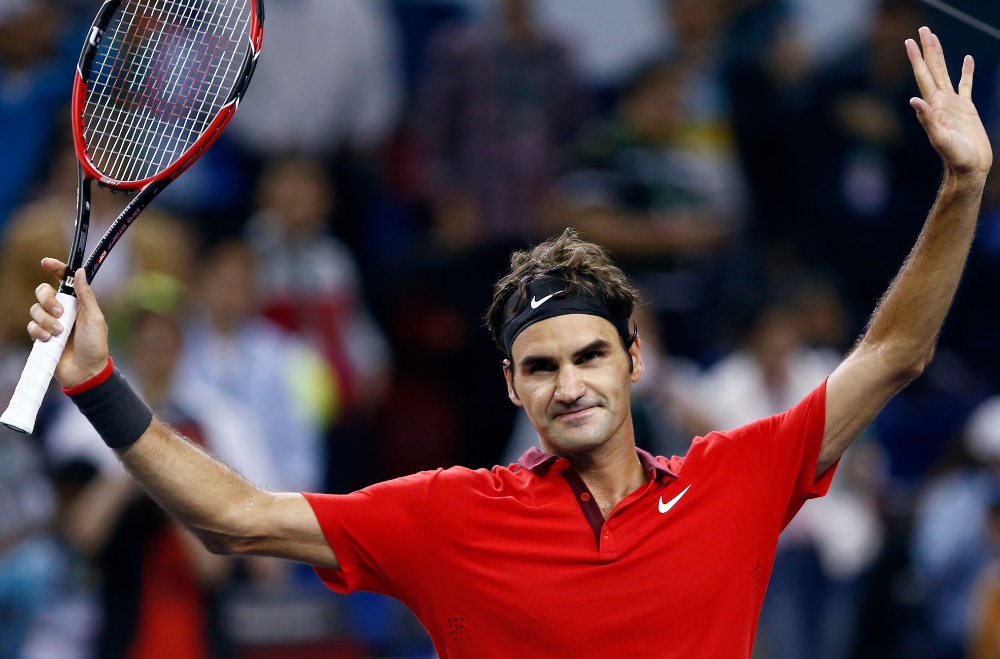Roger Federer of Switzerland celebrates winning his men's singles semi-final match against Novak Djokovic of Serbia at the Shanghai Masters tennis tournament in Shanghai