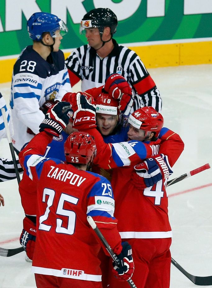 Russia's Viktor Tikhonov (C) celebrates his goal against Finland with team mates during the first period of their men's ice hockey World Championship group B game at Mins