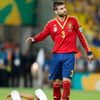 Spain's Gerard Pique walks away after fouling Brazil's Neyma