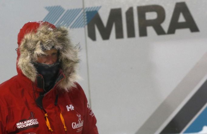 Britain's Prince Harry helps take down a tent during a cold chamber training exercise with the Walking with the Wounded South Pole Allied Challenge 2013 British team at Nuneaton in central