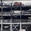 A view shows burnt vehicles in Terminal Car Park 2, following a fire at London Luton Airport, in Luton