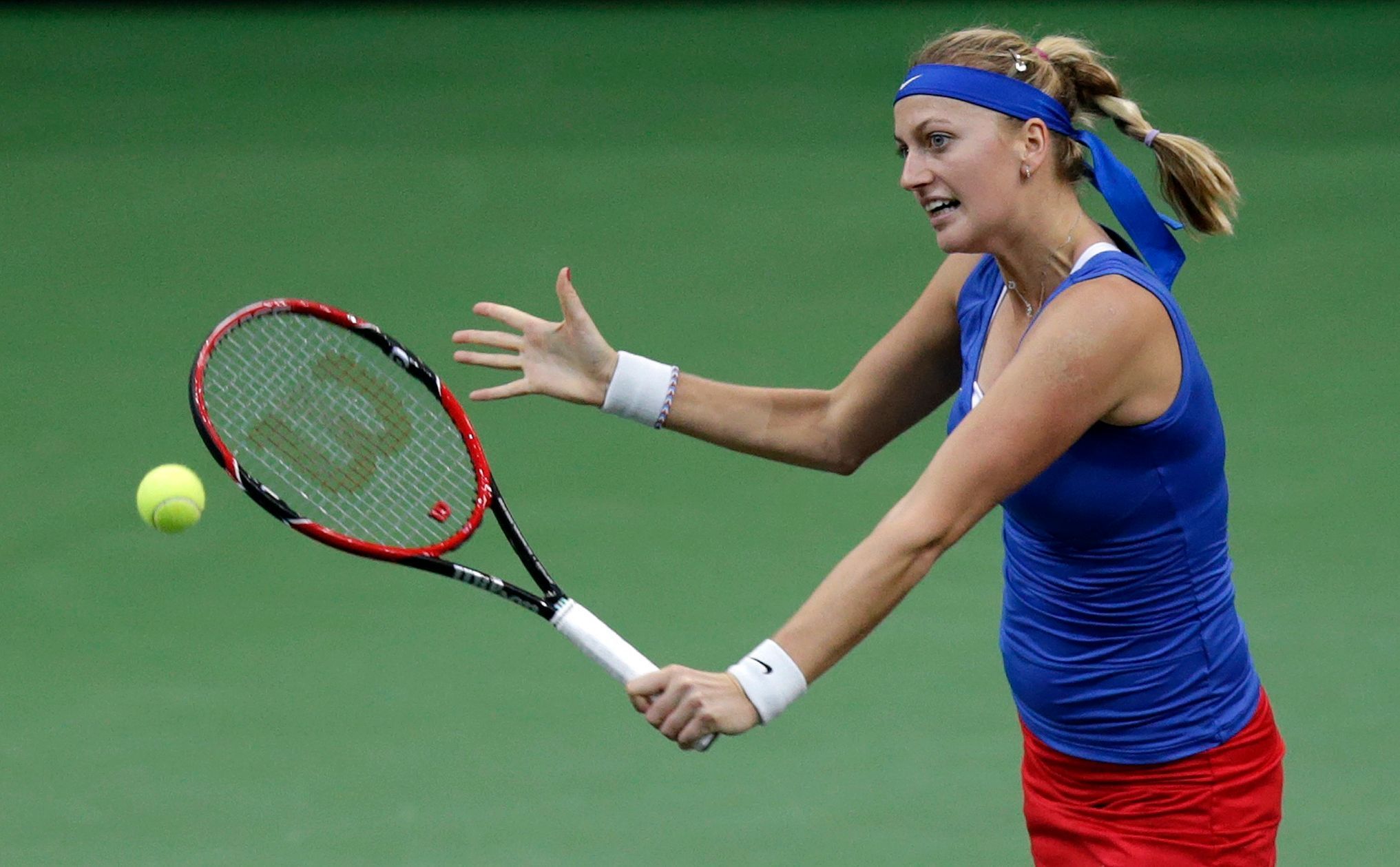 Czech Republic's Petra Kvitova returns a ball to Germany's Andrea Petkovic during their final match of the Fed Cup tennis tournament in Prague