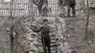 A soldier stands guard at a sentry post, at the banks of Yalu River, near the North Korean town of Sinuiju, opposite the Chinese border city of Dandong, March 30, 2013. China called for an easing of tensions on Friday as North Korea put its missile units on standby to attack U.S. military bases in South Korea and the Pacific after the United States flew two nuclear-capable stealth bombers over the Korean peninsula. REUTERS/Jacky Chen