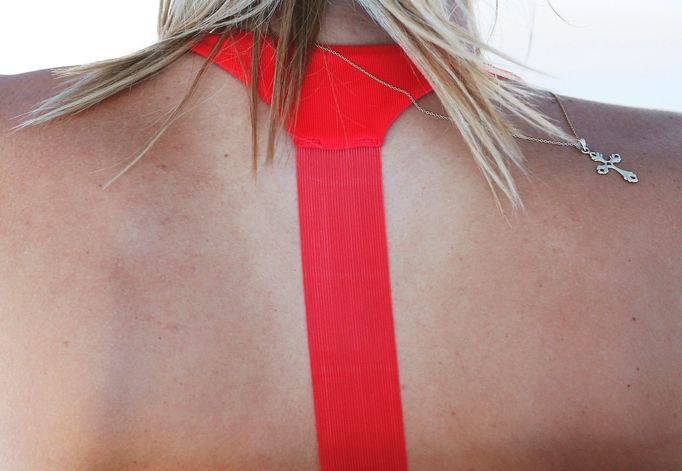 A necklace is pictured on the back of Maria Sharapova of Russia as she takes a break during her women's singles quarter-final match against Eugenie Bouchard of Canada at