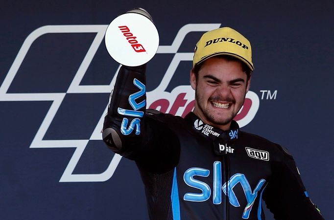 KTM Moto3 rider Romano Fenati of Italy celebrates on podium after winning the Spanish Grand Prix at Jerez racetrack in Jerez de la Frontera, southern Spain, May 4, 2014.