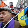 Man holds Ukrainian national flag during march to commemorate Kremlin critic Boris Nemtsov in central Moscow