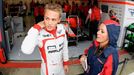 Marussia Formula One driver Max Chilton of Britain watches from the pit lane during first practice ahead of the British Grand Prix at the Silverstone Race circuit, centra