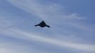 An X-47B pilot-less drone combat aircraft is pictured as it flies over the aircraft carrier, the USS George H. W. Bush, after being launched from the ship in the Atlantic Ocean off the coast of Virginia, May 14, 2013. The U.S. Navy made aviation history on Tuesday by catapulting an unmanned jet off an aircraft carrier for the first time, testing a long-range, stealthy, bat-winged plane that represents a jump forward in drone technology. REUTERS/Jason Reed (UNITED STATES - Tags: MILITARY SCIENCE TECHNOLOGY) Published: Kvě. 14, 2013, 6:50 odp.