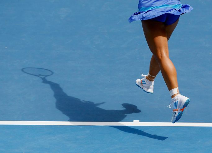 Angelique Kerber of Germany serves to Alla Kudryavtseva of Russia during their women's singles match at the Australian Open 2014 tennis tournament in Melbourne January 15