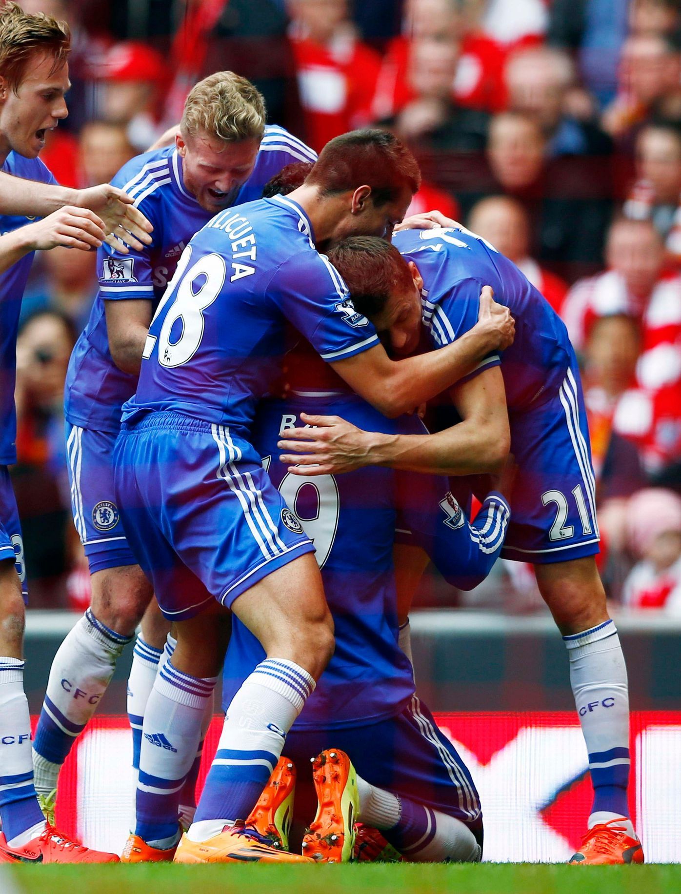 Chelsea's Ba celebrates with teammates after scoring a goal during their English Premier League soccer match against Liverpool at Anfield in Liverpool