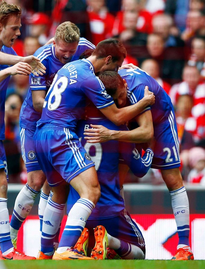 Chelsea's Ba celebrates with teammates after scoring a goal during their English Premier League soccer match against Liverpool at Anfield in Liverpool