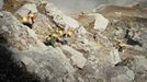 his photo taken on December 25, 2010 shows Indonesian miners carrying baskets of sulphur from the bottom of the crater of Indonesia's active Kajah Iwen volcano, in the ex