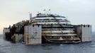 The Costa Concordia cruise liner is pictured from a ferry as it emerges during the refloating operation at Giglio harbour July 20, 2014.