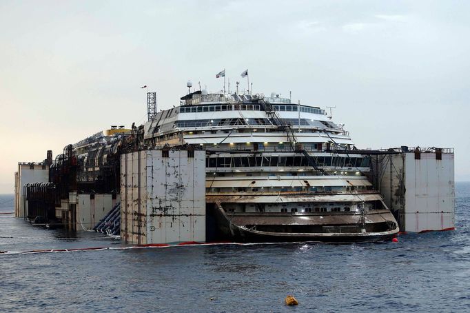 The Costa Concordia cruise liner is pictured from a ferry as it emerges during the refloating operation at Giglio harbour July 20, 2014.