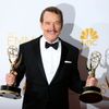 Bryan Cranston poses with his Outstanding Lead Actor in a Drama Series and Outstanding Drama Series awards at the 66th Primetime Emmy Awards in Los Angeles