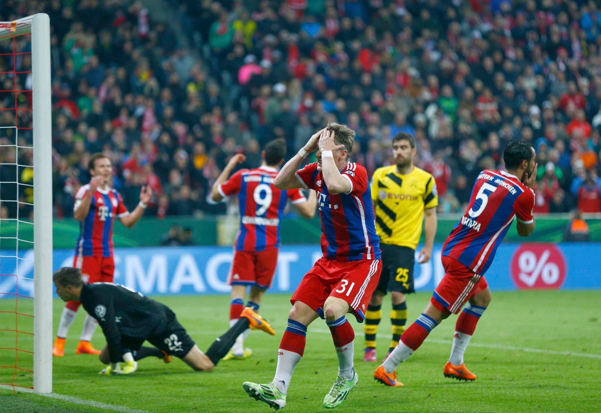 Bayern Munich's Schweinsteiger reacts after missing chance to score against Borussia Dortmund during German Cup semi-final soccer match in Munich