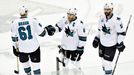 San Jose Sharks center Joe Pavelski (8) celebrates with defenseman Justin Braun (61) and center Patrick Marleau (12) after scoring an empty net goal