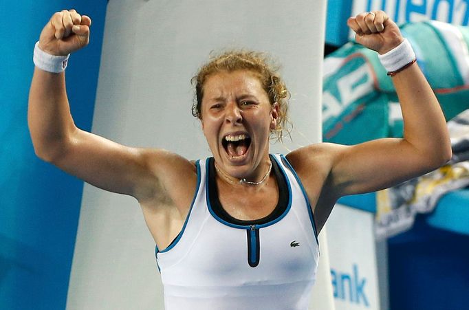 Germany's Anna-Lena Friedsam celebrates after winning her third round match against Italy's Roberta Vinci at the Australian Open tennis tournament at Melbourne Park, Aust