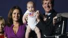 Patrick Kennedy and his wife Amy Petitgout pose with their four-month-old baby Owen Patrick Kennedy during the opening session of the 2012 Democratic National Convention in Charlotte, North Carolina September 4, 2012. REUTERS/Rick Wilking (UNITED STATES - Tags: POLITICS ELECTIONS) Published: Zář. 5, 2012, 12:52 dop.