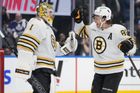 oston Bruins forward David Pastrnak (88) and goaltender Jeremy Swayman