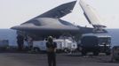 An X-47B pilot-less drone combat aircraft is pictured with its wings folded before being launched for the first time off an aircraft carrier, the USS George H. W. Bush, in the Atlantic Ocean off the coast of Virginia, May 14, 2013. The U.S. Navy made aviation history on Tuesday by catapulting an unmanned jet off an aircraft carrier for the first time, testing a long-range, stealthy, bat-winged plane that represents a jump forward in drone technology. REUTERS/Jason Reed (UNITED STATES - Tags: MILITARY SCIENCE TECHNOLOGY) Published: Kvě. 14, 2013, 7:15 odp.