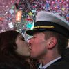 A couple kisses amid confetti as the clock strikes midnight during New Year's Eve celebrations in Times Square, New York