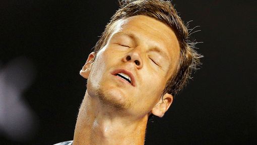 Tomas Berdych of Czech Republic reacts after missing a shot to Andy Murray of Britain during men's singles semi-final match at the Australian Open 2015 tennis tournament