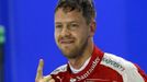 Ferrari Formula One driver Sebastian Vettel of Germany gestures after qualifying for the Singapore F1 Grand Prix at the Marina Bay street circuit September 19, 2015. REUT