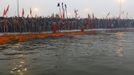 Naga Sadhus or Hindu holymen prepare to take a holy dip during first "Shahi Snan" (grand bath) at the ongoing "Kumbh Mela", or Pitcher Festival, in the northern Indian city of Allahabad January 14, 2013. Upwards of a million elated Hindu holy men and pilgrims took a bracing plunge in India's sacred Ganges river to wash away lifetimes of sins on Monday, in a raucous start to an ever-growing religious gathering that is already the world's largest. REUTERS/Ahmad Masood (INDIA - Tags: RELIGION SOCIETY) TEMPLATE OUT Published: Led. 14, 2013, 8:35 dop.