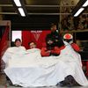 Crew members of the Oreca 03-Nissan Number 49 rest during th