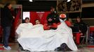 Crew members of the Oreca 03-Nissan Number 49 rest during the Le Mans 24-hour sportscar race in Le Mans, central France June 23, 2013. REUTERS/Stephane Mahe (FRANCE - Tag