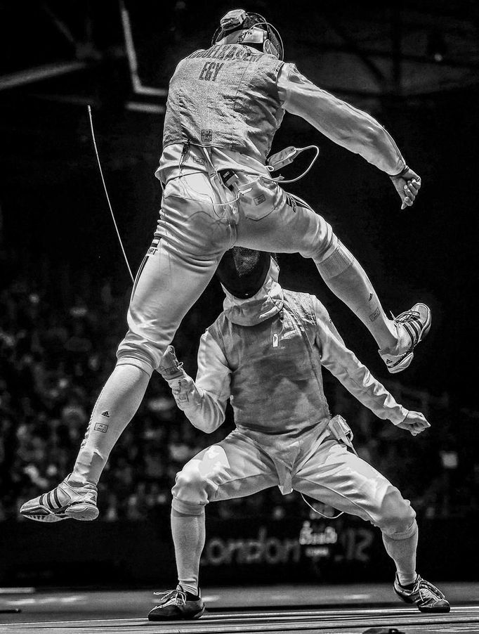 ATTENTION EDITORS - PICTURE 7 OF 18 OF THE WINNERS OF THE 56th WORLD PRESS PHOTO CONTEST 2013 Sergei Ilnitsky of Russia, a photographer working for the European Pressphoto Agency, has won the second prize in the Sports Action Stories category of the World Press Photo Contest 2013 with the series "The Golden Touch - Fencing at the Olympics". The picture shows Alaaeldin Abouelkassem of Egypt (top) in action against Peter Joppich of Germany during their Men's Foil Individual Round 16 at the London 2012 Olympic Games in London, taken on July 31, 2012 and distributed by the World Press Photo Foundation February 15, 2013. The prize-winning entries of the World Press Photo Contest 2013, the world's largest annual press photography contest, were announced today, February 15, 2013. REUTERS/Sergei Ilnitsky/European Pressphoto Agency/World Press Photo/Handout (BRITAIN - Tags: SPORT FENCING MEDIA SOCIETY) ATTENTION EDITORS - THIS IMAGE WAS PROVIDED BY A THIRD PARTY. FOR EDITORIAL USE ONLY. NOT FOR SALE FOR MARKETING OR ADVERTISING CAMPAIGNS. THIS PICTURE IS DISTRIBUTED EXACTLY AS RECEIVED BY REUTERS, AS A SERVICE TO CLIENTS. NO SALES. NO ARCHIVES. Published: Úno. 15, 2013, 10:05 dop.