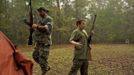 A member of the North Florida Survival Group and his young son gather their rifles before heading out to perform land navigation and enemy contact drills during a field training exercise in Old Town, Florida, December 8, 2012. The group trains children and adults alike to handle weapons and survive in the wild. The group passionately supports the right of U.S. citizens to bear arms and its website states that it aims to teach "patriots to survive in order to protect and defend our Constitution against all enemy threats". Picture taken December 8, 2013. REUTERS/Brian Blanco (UNITED STATES - Tags: SOCIETY POLITICS) ATTENTION EDITORS: PICTURE 5 OF 20 FOR PACKAGE 'TRAINING CHILD SURVIVALISTS' SEARCH 'FLORIDA SURVIVAL' FOR ALL IMAGES Published: Úno. 22, 2013, 1 odp.