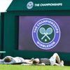 Spectators lay on the grass on Murray Mound before the start