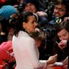 Actress Binoche signs autographs as she arrives on the red carpet for the screening of the movie 'Nobody Wants the Night', during the opening gala of the 65th Berlinale International Film Festival, in